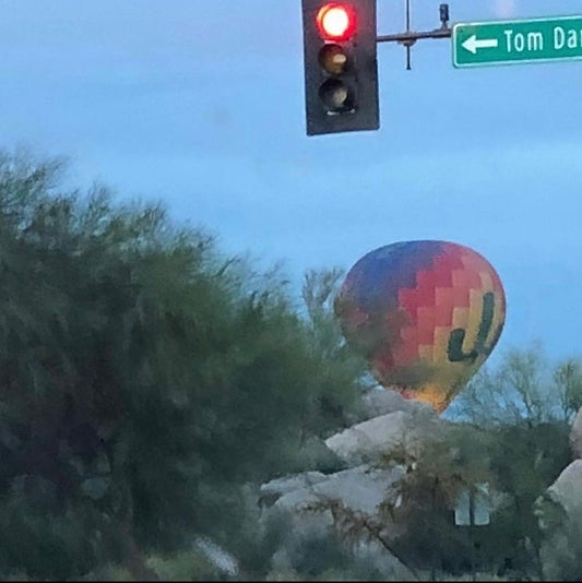 Hot air balloons in the sky in the springtime in Arizona