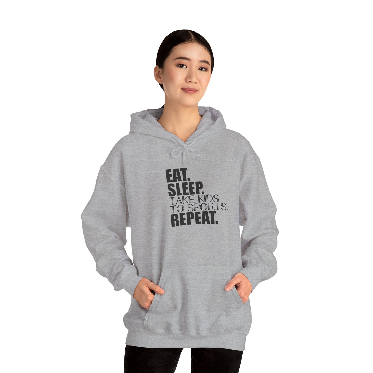 Unisex Heavy Blend™ Hooded Sweatshirt Reads, " Eat. Sleep. Take Kids to Sports. Repeat.