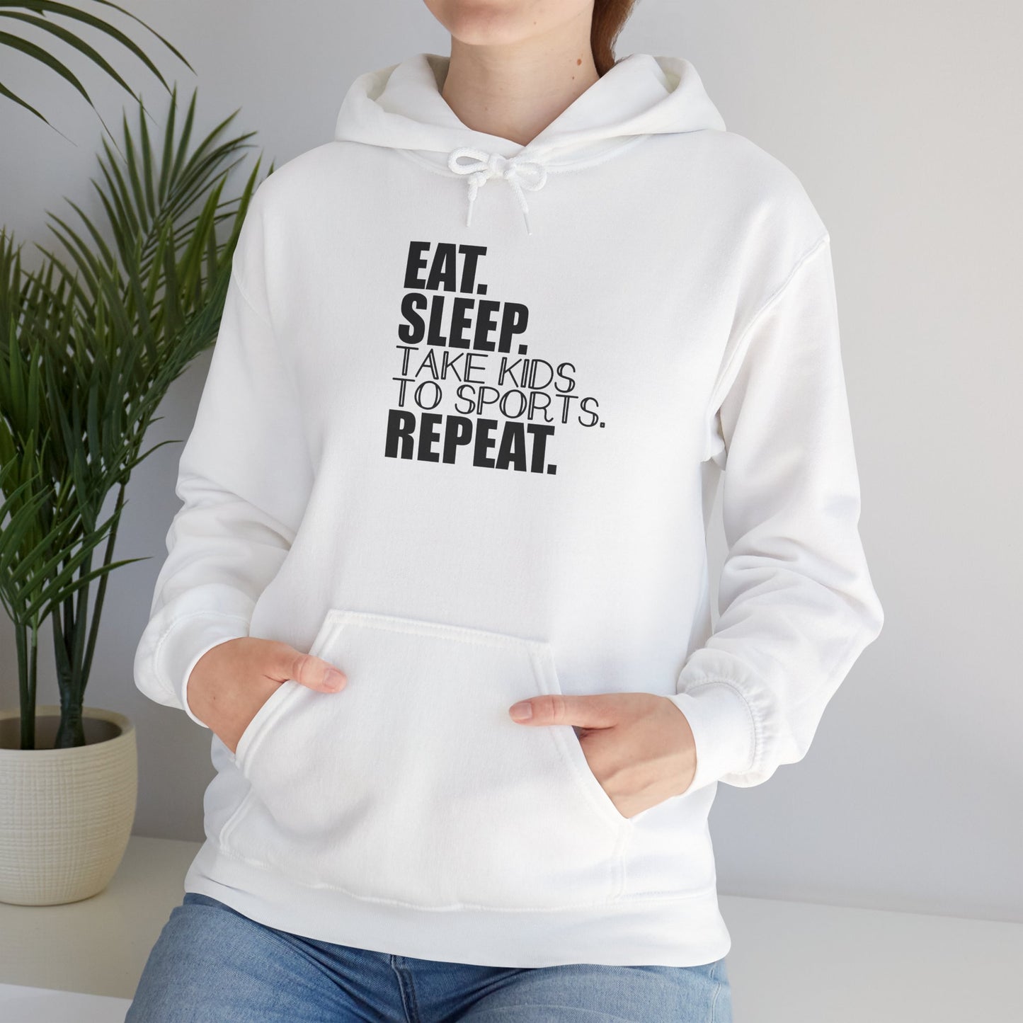 Unisex Heavy Blend™ Hooded Sweatshirt Reads, " Eat. Sleep. Take Kids to Sports. Repeat.