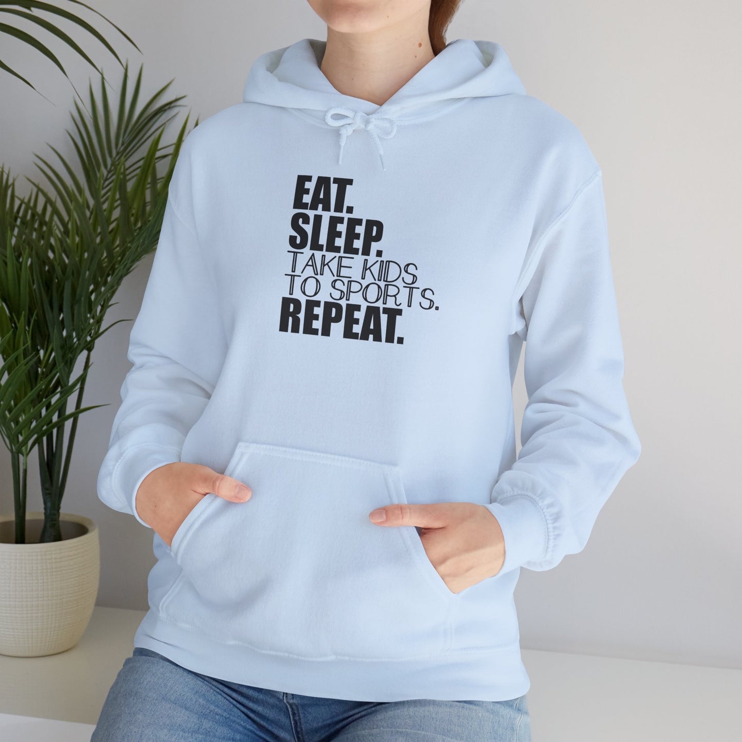 Unisex Heavy Blend™ Hooded Sweatshirt Reads, " Eat. Sleep. Take Kids to Sports. Repeat.