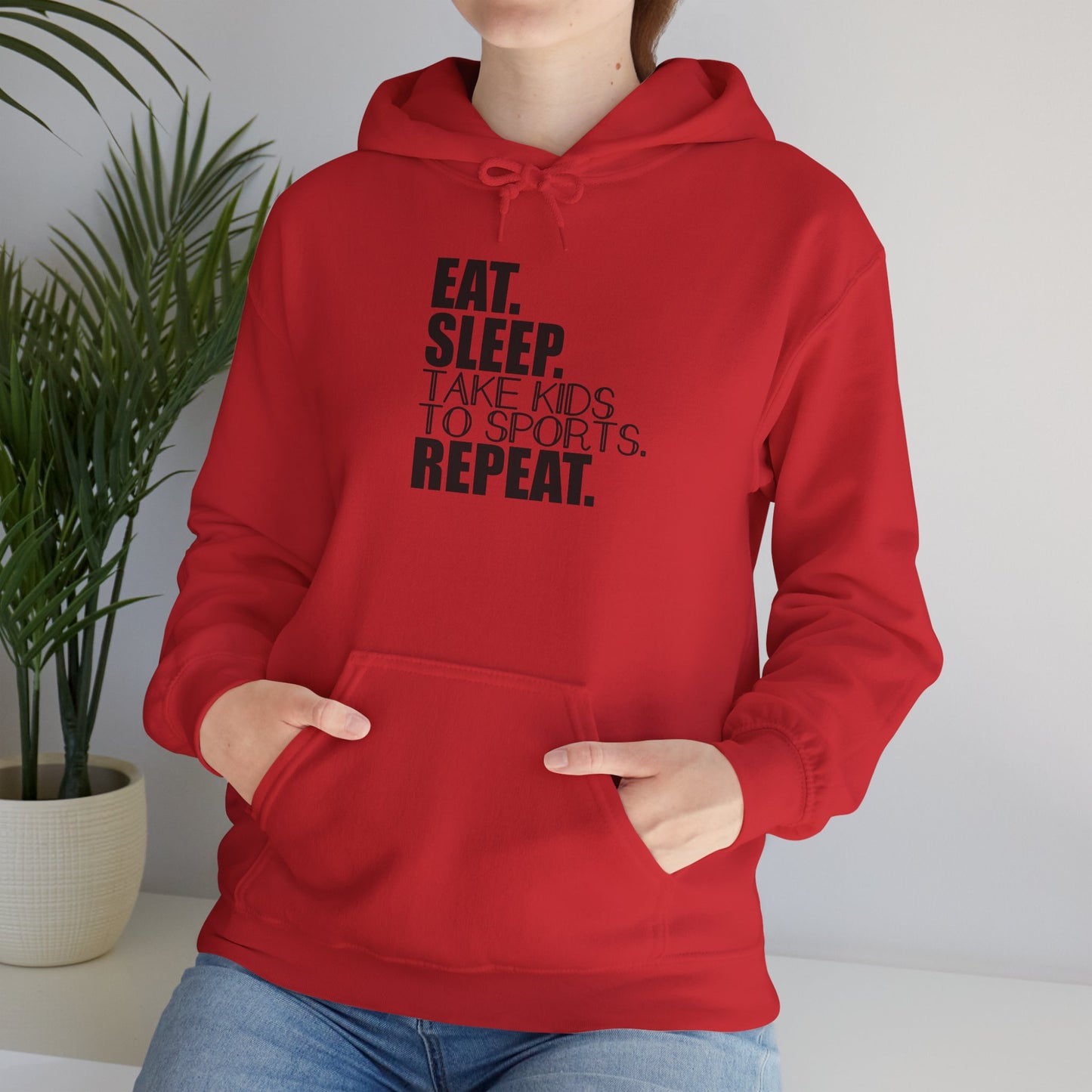 Unisex Heavy Blend™ Hooded Sweatshirt Reads, " Eat. Sleep. Take Kids to Sports. Repeat.